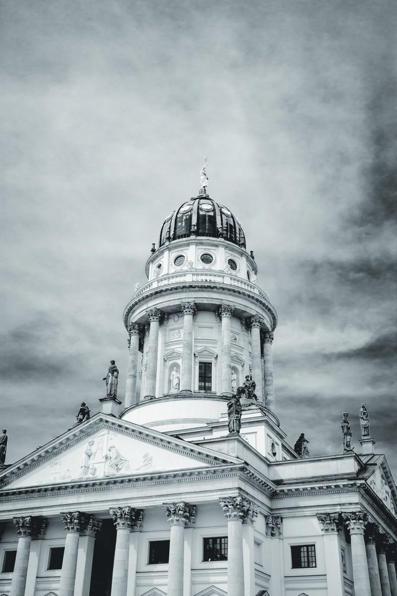 The tower and its dome stand out against a sky that seems to be moving.